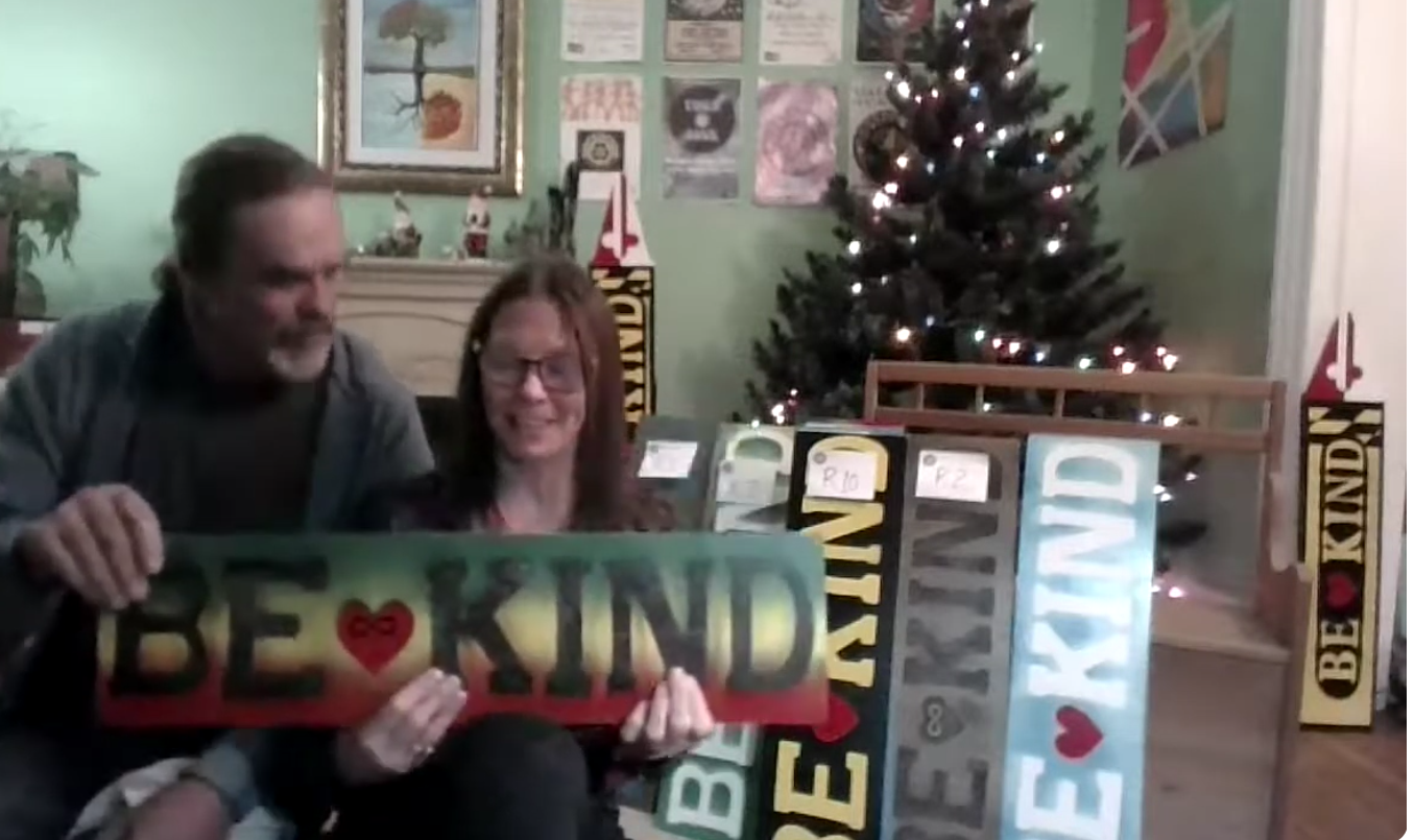 Parade of BE KIND Signs